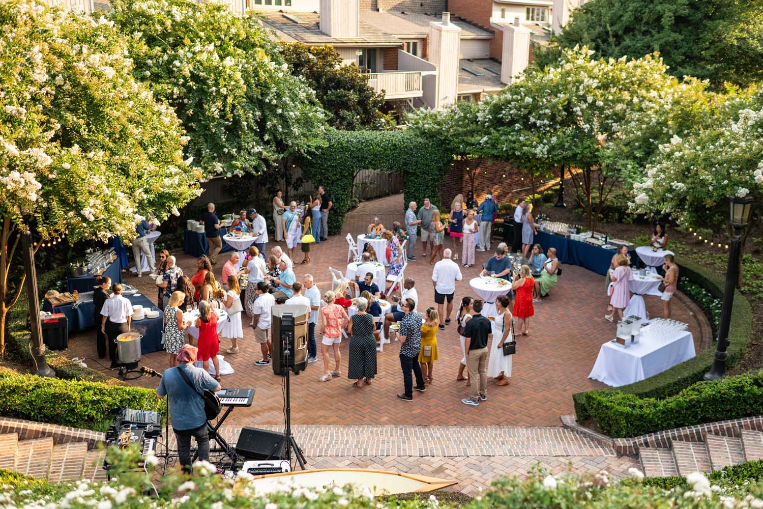 An outdoor event inside Becca's Sunken Garden at The Historic Cavalier Hotel