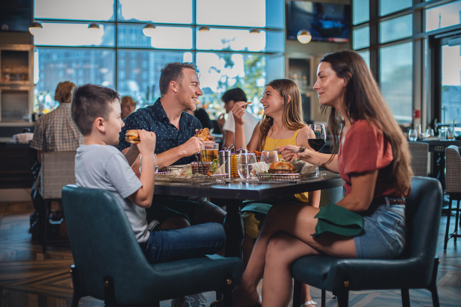 A family sitting at a table inside Arbuckle's Bar & Grill