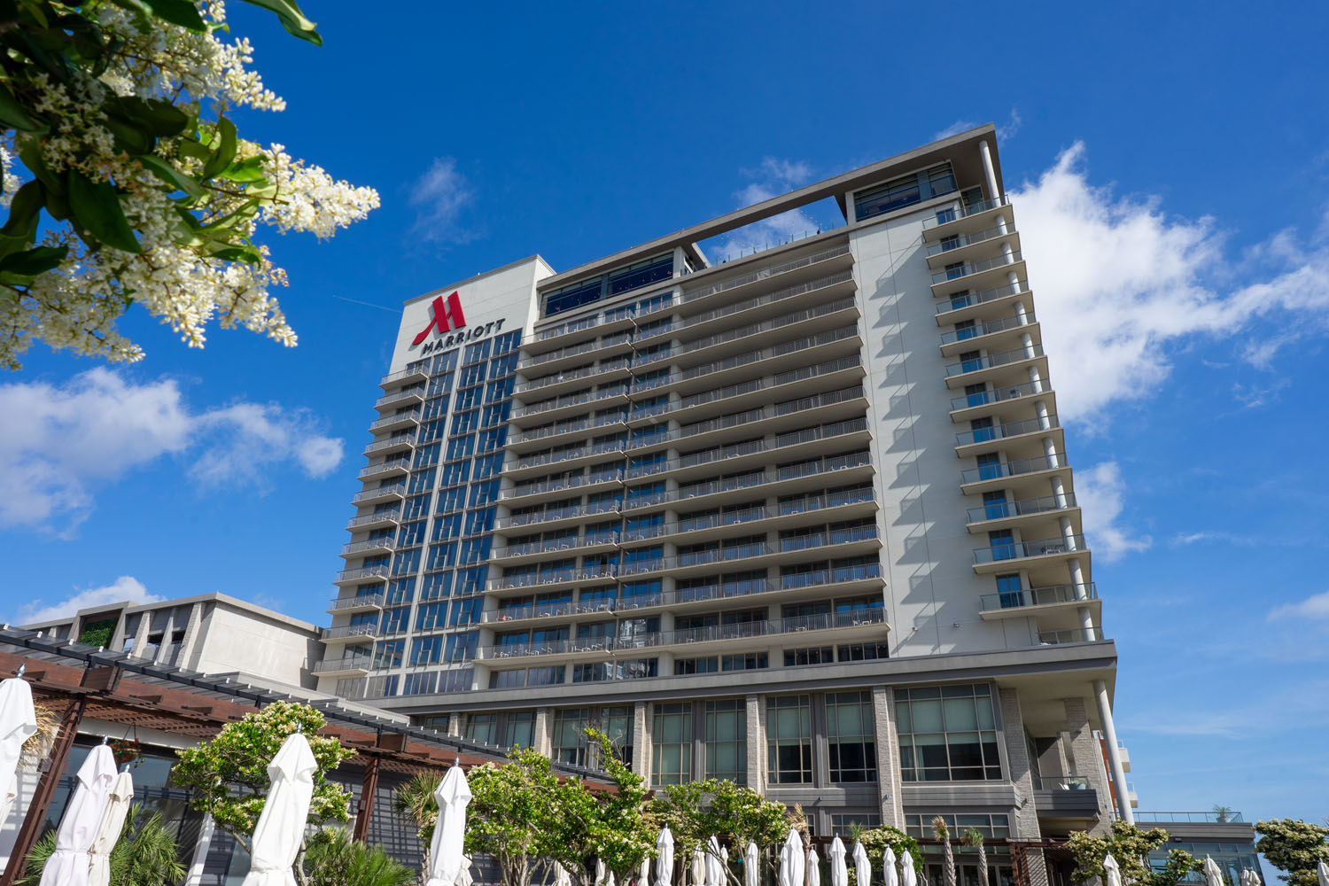 The exterior of the Marriott Virginia Beach Oceanfront Resort with bright blue skies