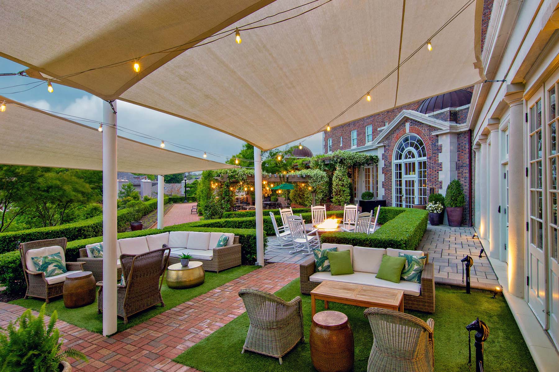 An outdoor seating area with a fire pit outside The Historic Cavalier Hotel