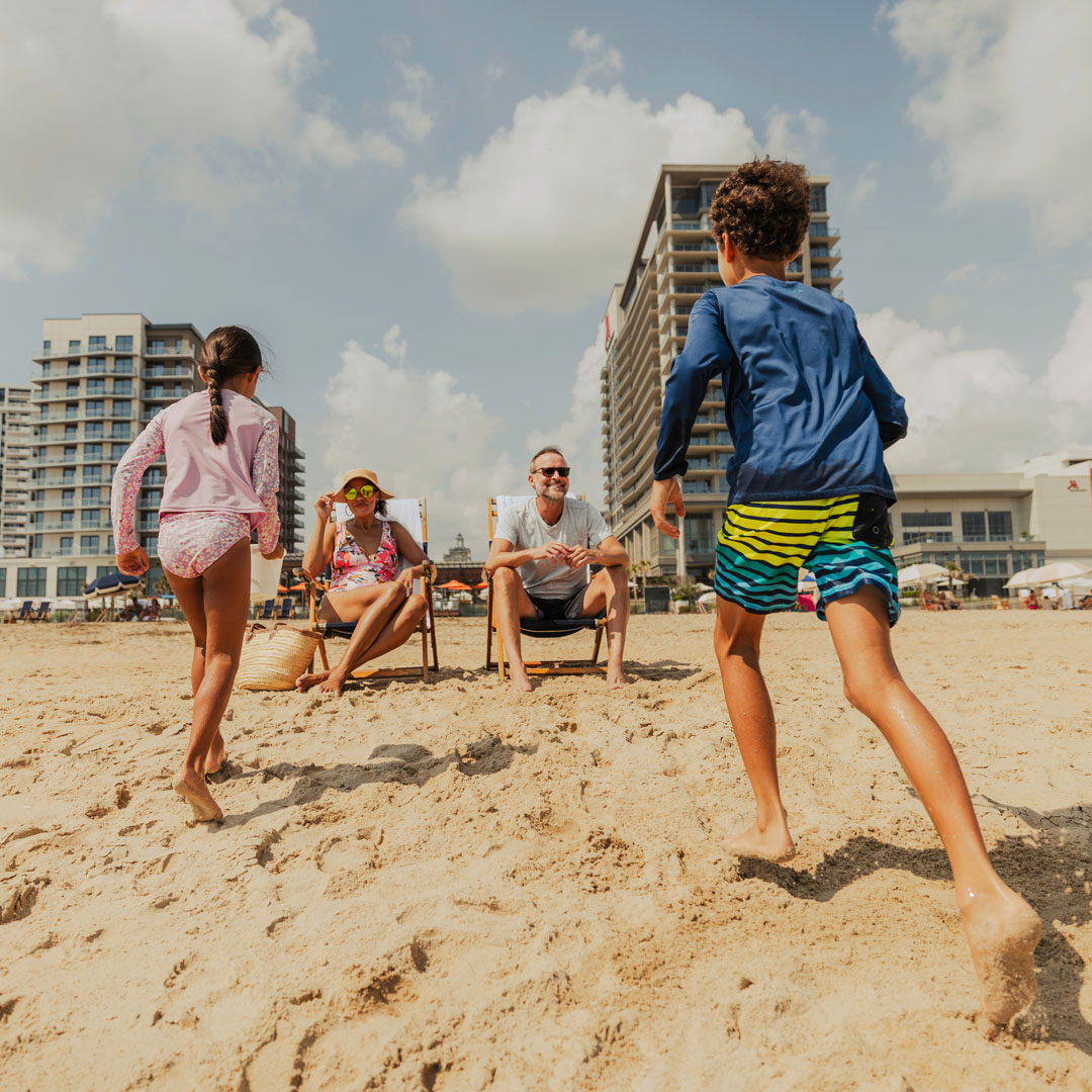 A family enjoying a sandy beach