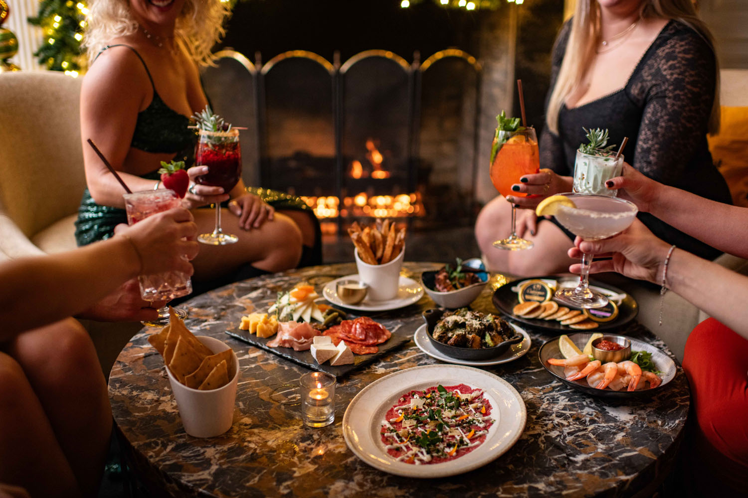 A table with food and drinks on it at The Raleigh Room inside The Cavalier Hotel