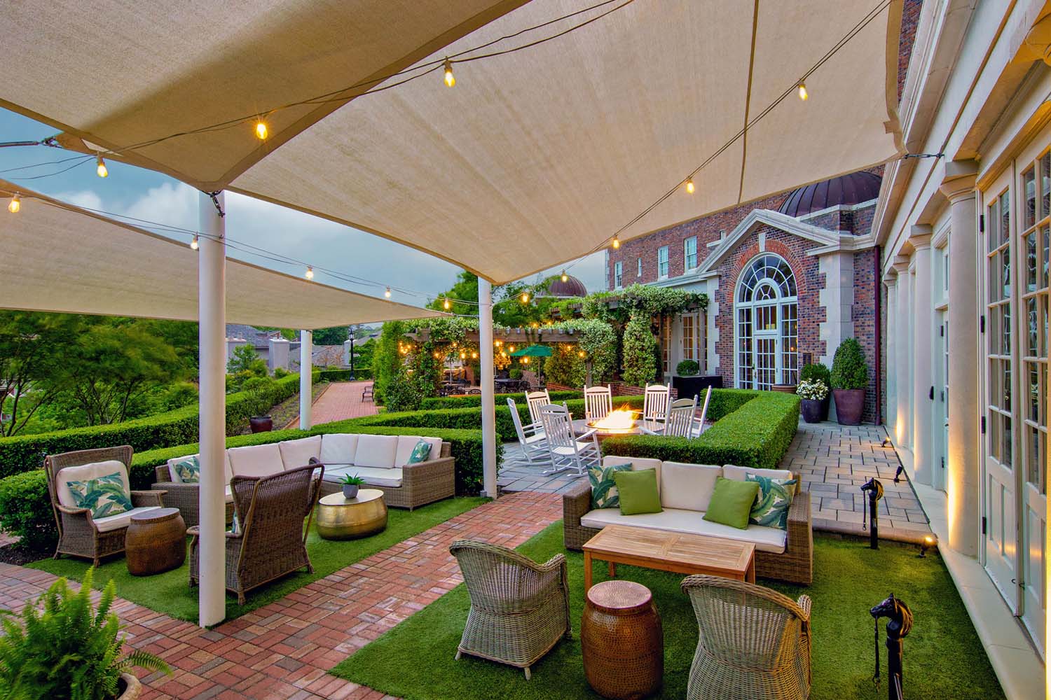 The outdoor patio and garden outside The Historic Cavalier Hotel