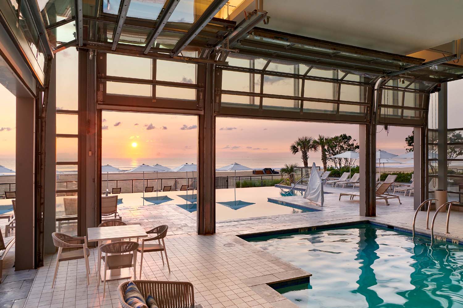 The indoor and outdoor pool at the Marriott Virginia Beach Oceanfront Resort at sunrise