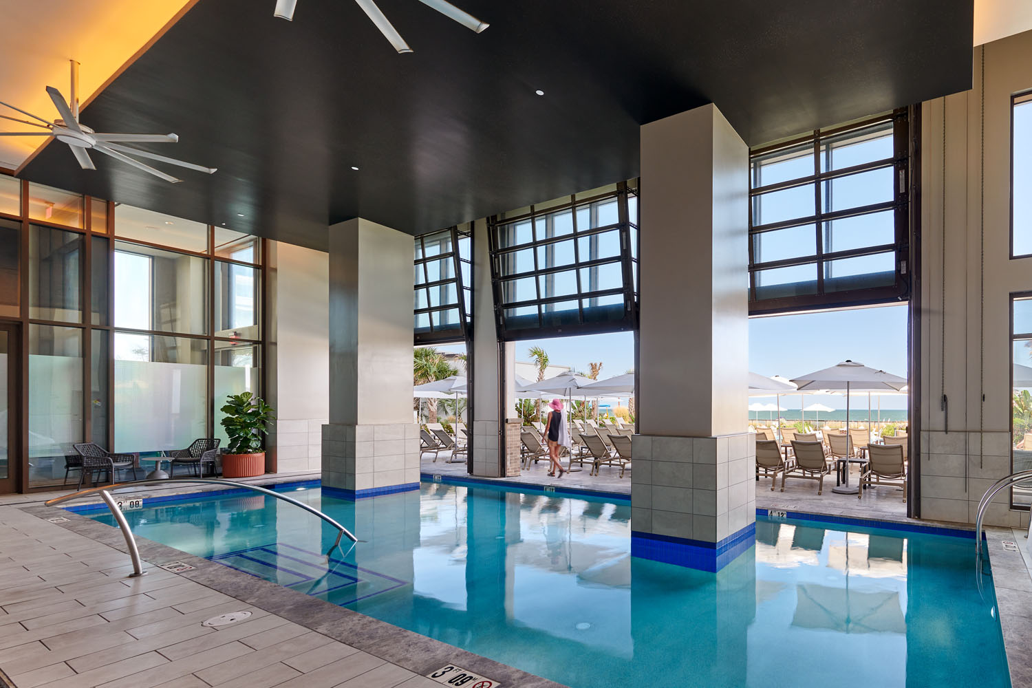 The indoor and outdoor pools and lounge area at the Embassy Suites hotel at the Cavalier Resort