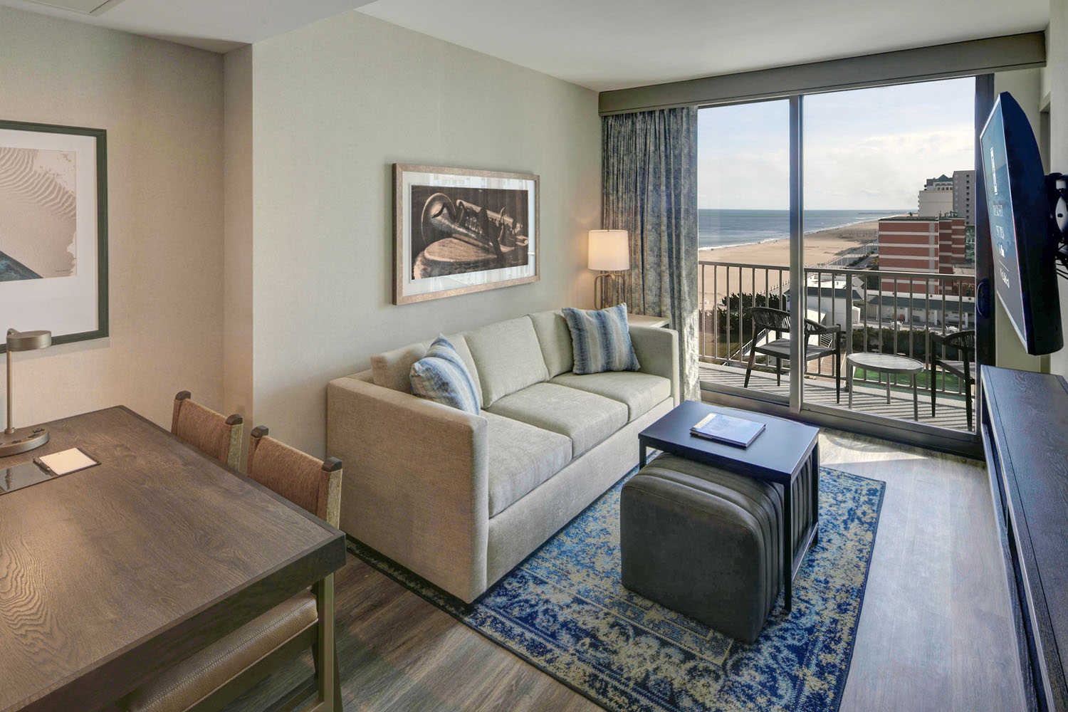 A king two-room suite inside the Embassy Suites Virginia Beach Oceanfront Resort