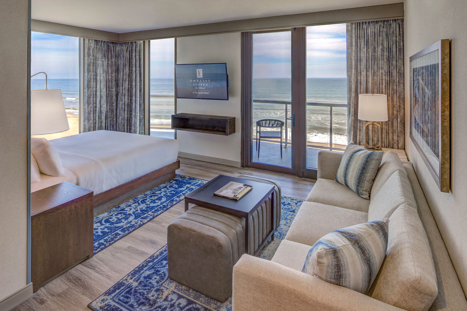 A king oceanfront studio suite inside the Embassy Suites Virginia Beach Oceanfront Resort