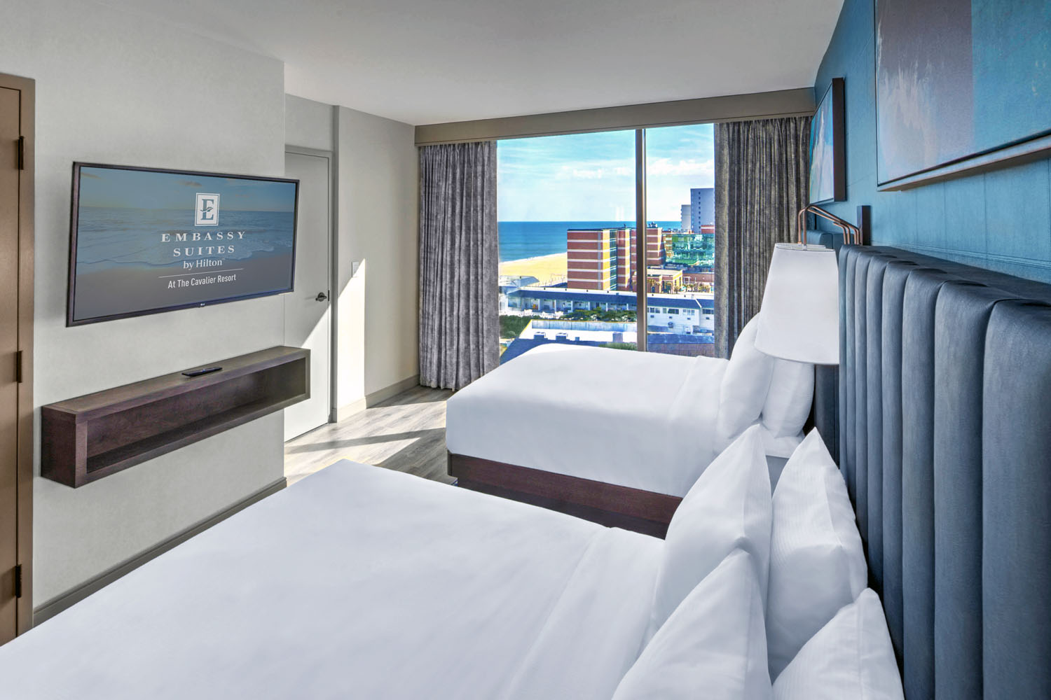 A two queen, two-room suite inside the Embassy Suites Virginia Beach Oceanfront Resort